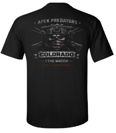 A black short-sleeve t-shirt shown from the back, featuring a large graphic print with a tactical skull and crossed rifles. The text reads 'APEX PREDATORS', 'COLORADO', 'I THE WATCH', and 'DEATH FROM ABOVE' in distressed white and red lettering.