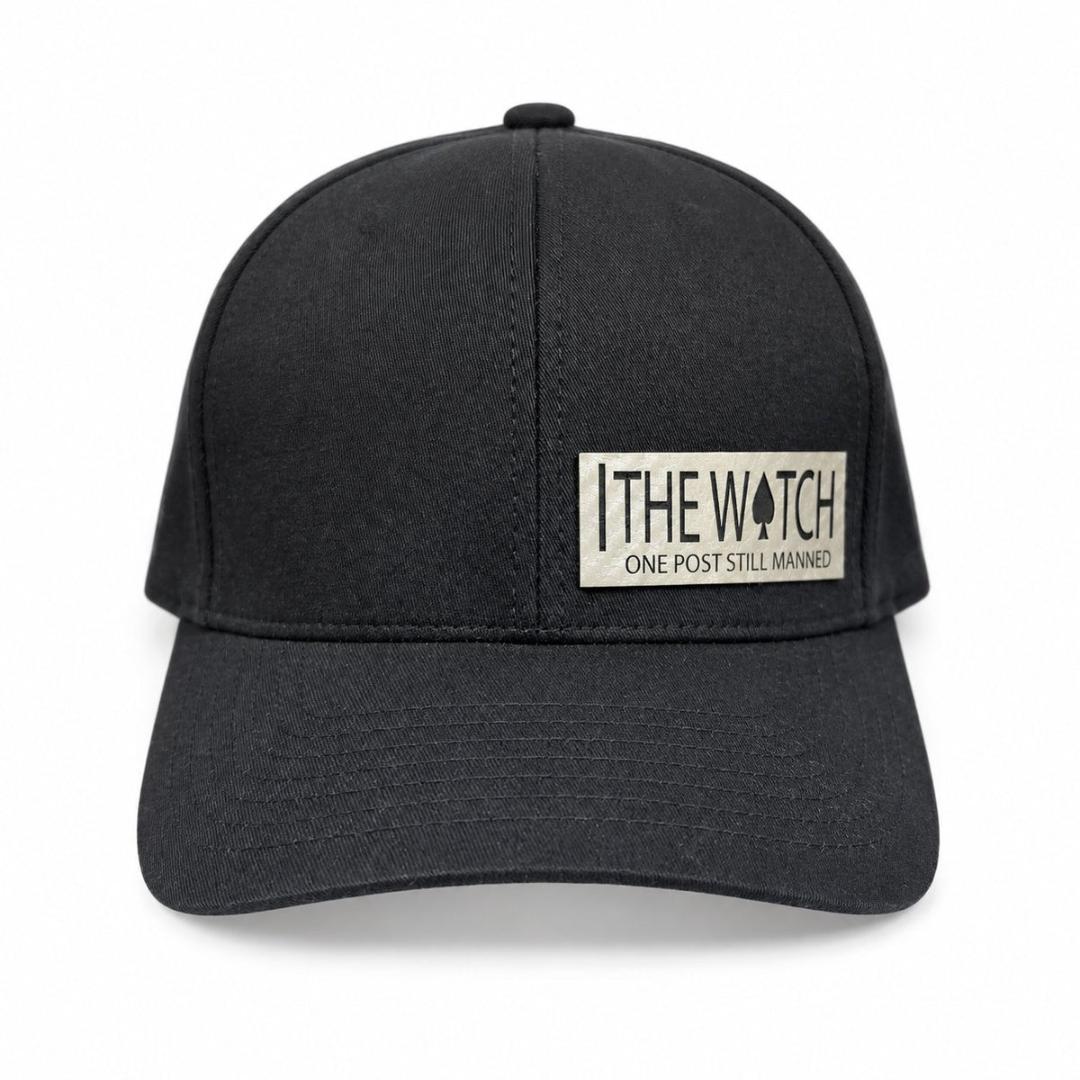 Black hat with a light-colored The Watch leatherette patch and One Post Still Manned lettering.