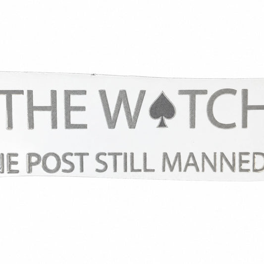 Detail photo of The Watch wordmark with the One Post Still Manned line; the outer edges are outside the photograph.